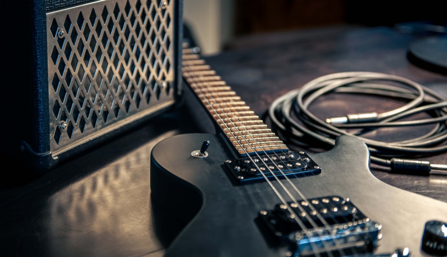 closeup-black-electric-guitar-dark-background.mijpg